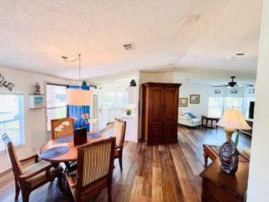 This two-bedroom, two-bathroom home in the gated golf community on Pine Lakes Country Club in Florida - for sale on GolfHomes.com, golf home, golf lot