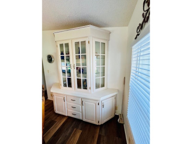 This two-bedroom, two-bathroom home in the gated golf community on Pine Lakes Country Club in Florida - for sale on GolfHomes.com, golf home, golf lot