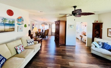 This two-bedroom, two-bathroom home in the gated golf community on Pine Lakes Country Club in Florida - for sale on GolfHomes.com, golf home, golf lot