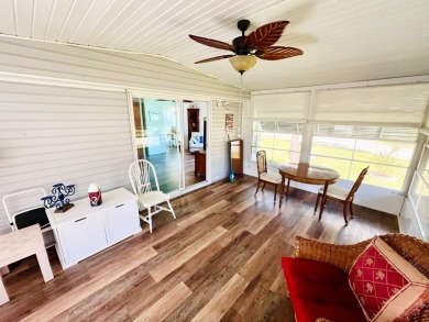This two-bedroom, two-bathroom home in the gated golf community on Pine Lakes Country Club in Florida - for sale on GolfHomes.com, golf home, golf lot