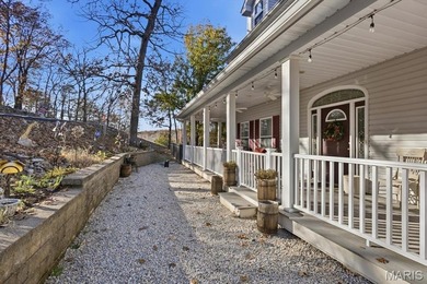 This stunning two-story home offers over 4,000 square feet of on Raintree Country Club in Missouri - for sale on GolfHomes.com, golf home, golf lot