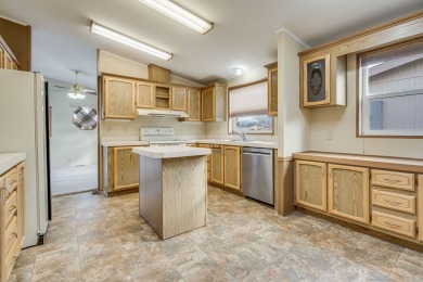 Discover the perfect blend of comfort  convenience in this on Village Greens Golf Club in Montana - for sale on GolfHomes.com, golf home, golf lot