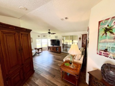 This two-bedroom, two-bathroom home in the gated golf community on Pine Lakes Country Club in Florida - for sale on GolfHomes.com, golf home, golf lot