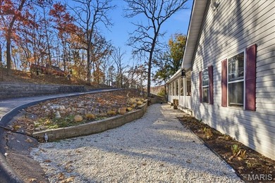 This stunning two-story home offers over 4,000 square feet of on Raintree Country Club in Missouri - for sale on GolfHomes.com, golf home, golf lot