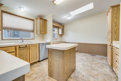 Discover the perfect blend of comfort  convenience in this on Village Greens Golf Club in Montana - for sale on GolfHomes.com, golf home, golf lot