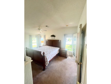 This two-bedroom, two-bathroom home in the gated golf community on Pine Lakes Country Club in Florida - for sale on GolfHomes.com, golf home, golf lot