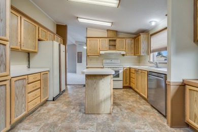 Discover the perfect blend of comfort  convenience in this on Village Greens Golf Club in Montana - for sale on GolfHomes.com, golf home, golf lot