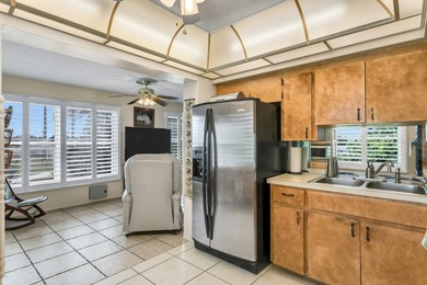 Light, bright, and beautifully maintained TOP-FLOOR CORNER on On Top Of The World Golf Course in Florida - for sale on GolfHomes.com, golf home, golf lot