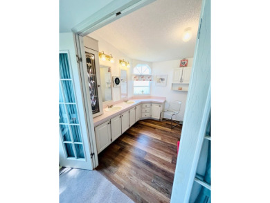 This two-bedroom, two-bathroom home in the gated golf community on Pine Lakes Country Club in Florida - for sale on GolfHomes.com, golf home, golf lot