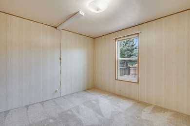 Discover the perfect blend of comfort  convenience in this on Village Greens Golf Club in Montana - for sale on GolfHomes.com, golf home, golf lot