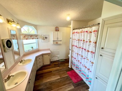 This two-bedroom, two-bathroom home in the gated golf community on Pine Lakes Country Club in Florida - for sale on GolfHomes.com, golf home, golf lot