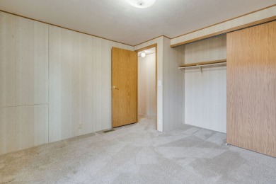 Discover the perfect blend of comfort  convenience in this on Village Greens Golf Club in Montana - for sale on GolfHomes.com, golf home, golf lot