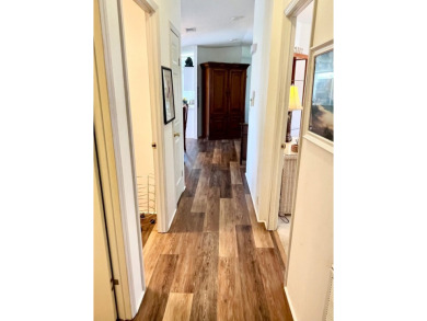This two-bedroom, two-bathroom home in the gated golf community on Pine Lakes Country Club in Florida - for sale on GolfHomes.com, golf home, golf lot