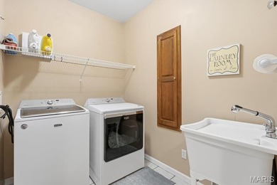 This stunning two-story home offers over 4,000 square feet of on Raintree Country Club in Missouri - for sale on GolfHomes.com, golf home, golf lot