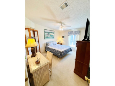 This two-bedroom, two-bathroom home in the gated golf community on Pine Lakes Country Club in Florida - for sale on GolfHomes.com, golf home, golf lot