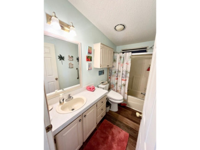 This two-bedroom, two-bathroom home in the gated golf community on Pine Lakes Country Club in Florida - for sale on GolfHomes.com, golf home, golf lot