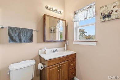 This stunning two-story home offers over 4,000 square feet of on Raintree Country Club in Missouri - for sale on GolfHomes.com, golf home, golf lot