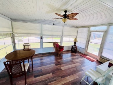 This two-bedroom, two-bathroom home in the gated golf community on Pine Lakes Country Club in Florida - for sale on GolfHomes.com, golf home, golf lot