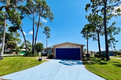 This two-bedroom, two-bathroom home in the gated golf community on Pine Lakes Country Club in Florida - for sale on GolfHomes.com, golf home, golf lot