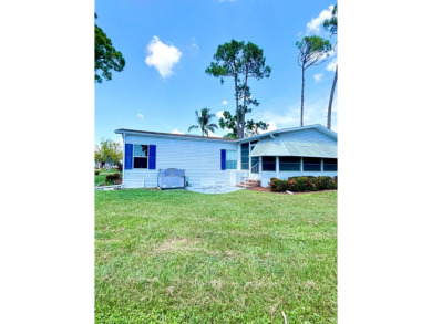 This two-bedroom, two-bathroom home in the gated golf community on Pine Lakes Country Club in Florida - for sale on GolfHomes.com, golf home, golf lot