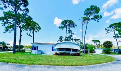 This two-bedroom, two-bathroom home in the gated golf community on Pine Lakes Country Club in Florida - for sale on GolfHomes.com, golf home, golf lot