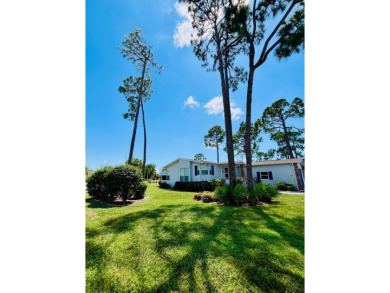 This two-bedroom, two-bathroom home in the gated golf community on Pine Lakes Country Club in Florida - for sale on GolfHomes.com, golf home, golf lot