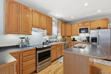 This stunning two-story home offers over 4,000 square feet of on Raintree Country Club in Missouri - for sale on GolfHomes.com, golf home, golf lot