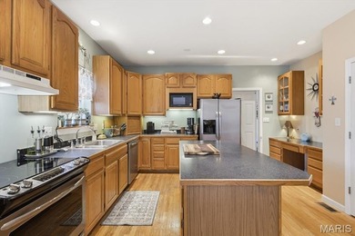 This stunning two-story home offers over 4,000 square feet of on Raintree Country Club in Missouri - for sale on GolfHomes.com, golf home, golf lot