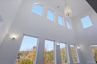 This stunning two-story home offers over 4,000 square feet of on Raintree Country Club in Missouri - for sale on GolfHomes.com, golf home, golf lot
