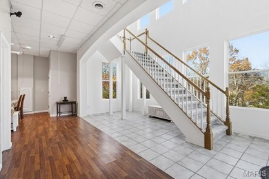 This stunning two-story home offers over 4,000 square feet of on Raintree Country Club in Missouri - for sale on GolfHomes.com, golf home, golf lot