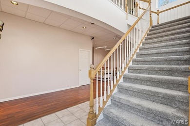 This stunning two-story home offers over 4,000 square feet of on Raintree Country Club in Missouri - for sale on GolfHomes.com, golf home, golf lot