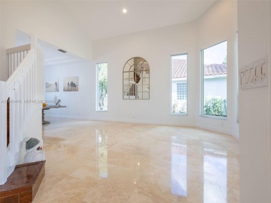 Experience luxury living in Weston Hills, a premier gated golf on Weston Hills Country Club in Florida - for sale on GolfHomes.com, golf home, golf lot