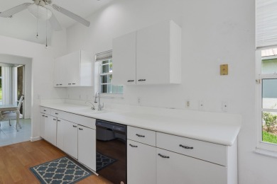 Invest in Location with this Lakefront property overlooking the on Meadowood Golf and Tennis Club in Florida - for sale on GolfHomes.com, golf home, golf lot