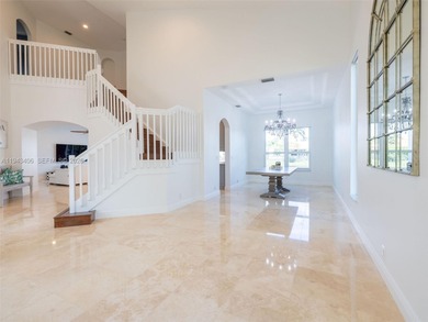 Experience luxury living in Weston Hills, a premier gated golf on Weston Hills Country Club in Florida - for sale on GolfHomes.com, golf home, golf lot