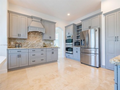 Experience luxury living in Weston Hills, a premier gated golf on Weston Hills Country Club in Florida - for sale on GolfHomes.com, golf home, golf lot