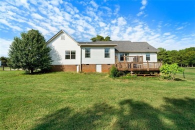 Welcome to this stunning 4-bedroom, 2.5-bath brick home nestled on Meadow Lakes Golf Course in Georgia - for sale on GolfHomes.com, golf home, golf lot