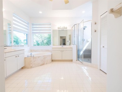 Experience luxury living in Weston Hills, a premier gated golf on Weston Hills Country Club in Florida - for sale on GolfHomes.com, golf home, golf lot