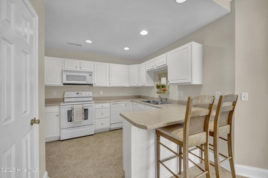 Welcome to 7809 Trap Way, a light-filled end-unit townhome in on Masonboro Country Club in North Carolina - for sale on GolfHomes.com, golf home, golf lot