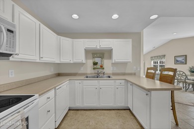 Welcome to 7809 Trap Way, a light-filled end-unit townhome in on Masonboro Country Club in North Carolina - for sale on GolfHomes.com, golf home, golf lot