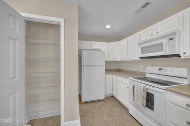 Welcome to 7809 Trap Way, a light-filled end-unit townhome in on Masonboro Country Club in North Carolina - for sale on GolfHomes.com, golf home, golf lot