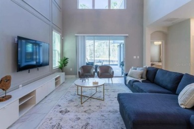 Step into luxury at this stunning 5-bedroom, 5-bath residence on National Golf Course in Florida - for sale on GolfHomes.com, golf home, golf lot