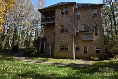 Unique two story with basement in golf course community. Nice on Pine Island Country Club in North Carolina - for sale on GolfHomes.com, golf home, golf lot