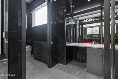 Step into a Masterpiece of Modern Sophistication

Privately on Plantation Bay Golf and Country Club in Florida - for sale on GolfHomes.com, golf home, golf lot