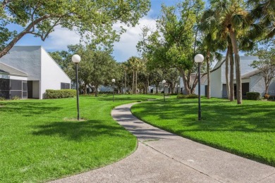 Meticulously maintained, beautifully updated and is very well on Carrollwood Country Club in Florida - for sale on GolfHomes.com, golf home, golf lot