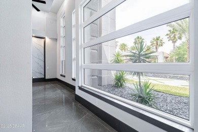 Step into a Masterpiece of Modern Sophistication

Privately on Plantation Bay Golf and Country Club in Florida - for sale on GolfHomes.com, golf home, golf lot