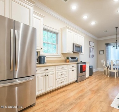 Charming 4-bedroom, 2-bath, two-story home offering over 2,000 on Diamondhead Country Club in Mississippi - for sale on GolfHomes.com, golf home, golf lot