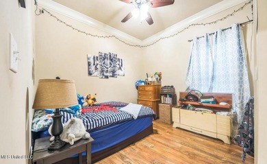 Charming 4-bedroom, 2-bath, two-story home offering over 2,000 on Diamondhead Country Club in Mississippi - for sale on GolfHomes.com, golf home, golf lot