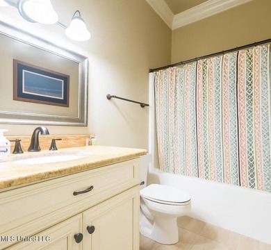 Charming 4-bedroom, 2-bath, two-story home offering over 2,000 on Diamondhead Country Club in Mississippi - for sale on GolfHomes.com, golf home, golf lot