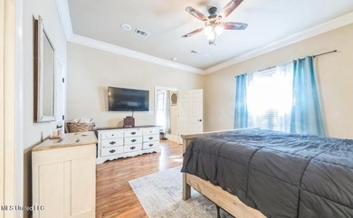 Charming 4-bedroom, 2-bath, two-story home offering over 2,000 on Diamondhead Country Club in Mississippi - for sale on GolfHomes.com, golf home, golf lot