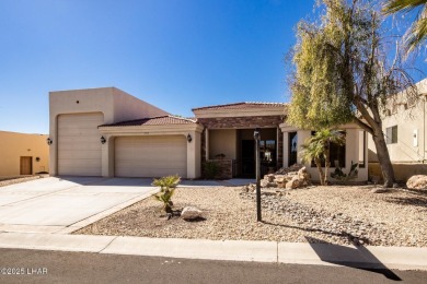 Take a look at this stunning RV garage home located in a private on London Bridge Golf Course in Arizona - for sale on GolfHomes.com, golf home, golf lot